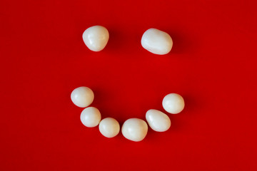 funny smile sticking out of stones