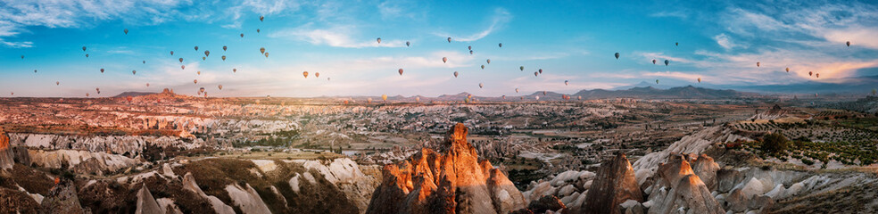 Panorama of Cappadocia with balloons at sunset