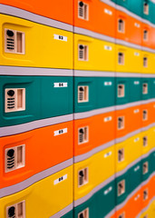 Rows of colorful safety boxes -  orange, yellow and green.