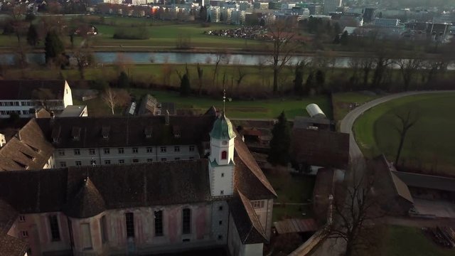 Aerial drone shot orbiting around Fahr Monastery in Unterengstringen, Switzerland 60fps