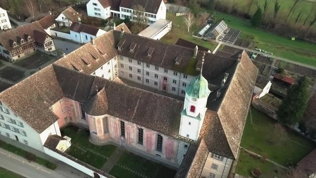 Aerial drone pullback shot over Fahr Monastery in Unterengstringen, Switzerland
