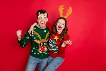 Photo of excited pair lady and guy chilling at newyear theme costume party wear funky knitted...