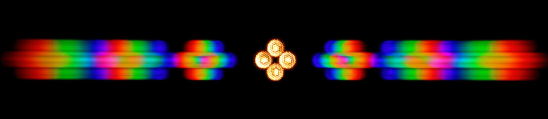 Photo of the diffraction pattern of LED array light, comprising a large number of diffraction orders obtained by the phase grating