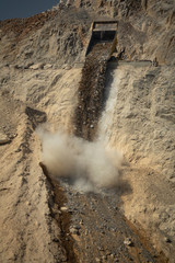 Dumper unload stones from mine to dump