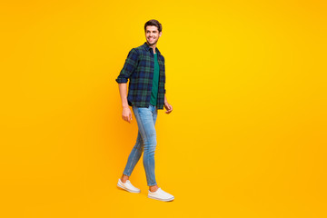 Fototapeta na wymiar Full length body size photo of cheerful handsome man wearing jeans denim wearing footwear isolated vivid color background