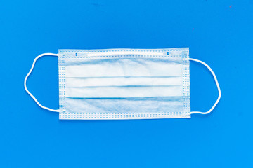 simple white air protection mask on the color surface