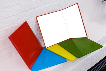 Open colorful books isolated on white background