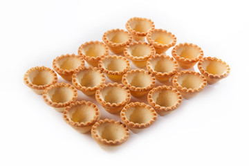 Forms for appetizers from unleavened dough in large quantities. View from above. Isolated object on a white background.