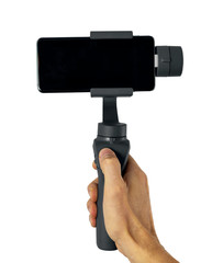 phone gimbal stabilizer in hand isolated on white background