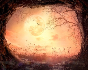 Thanksgiving concept: Scary cave stone on full moon in autumn night wallpaper background - 3D illustration © Choat