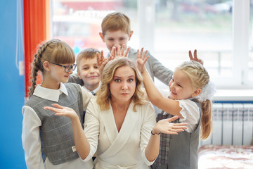 group of students having fun with their teacher