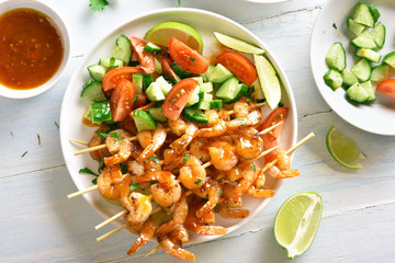 Prawns skewers with sauce