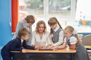 a group of preschoolers in classes on mental arithmetic with abacus soroban