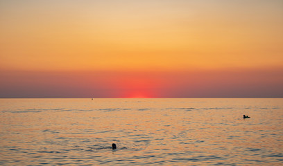 Sunny sunset on a warm and clear sea