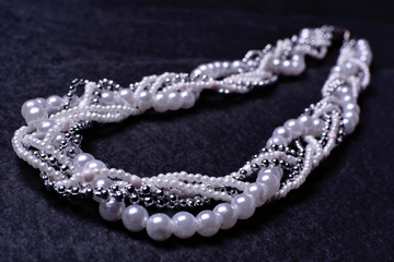Pearl necklace on a black background