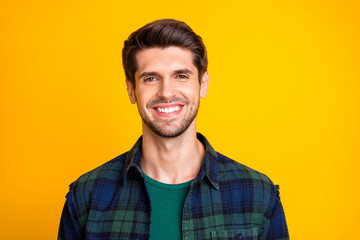 Obraz premium Close up photo of amazing macho guy revealing perfect white teeth wear casual plaid shirt isolated yellow color background