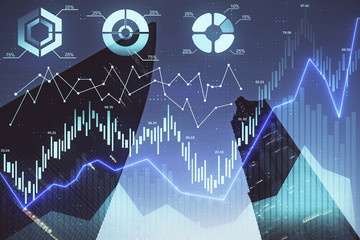 Forex chart on cityscape with tall buildings background multi exposure. Financial research concept.