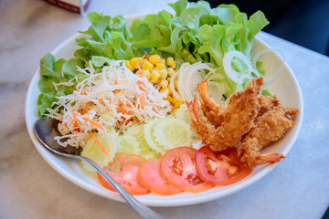 Vegetable salad in a white bowl