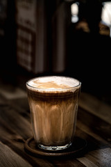 cup of coffee on wooden table