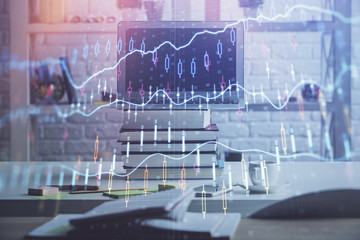 Forex market graph hologram and personal computer on background. Multi exposure. Concept of investment.