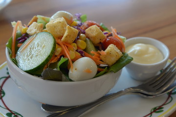 Vegetable salad in a white bowl