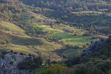 Fototapeta na wymiar Cyprus rocky hills with agriculture, houses and small churches