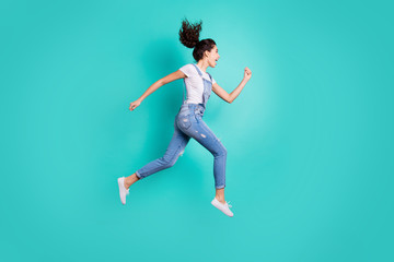 Fototapeta na wymiar Full length body size view of nice attractive cheerful cheery glad excited purposeful wavy-haired girl jumping running fast isolated on bright vivid shine vibrant green turquoise background
