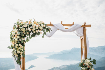 Close-up of flowers on a beautiful wedding arch. Preparing for the wedding event.