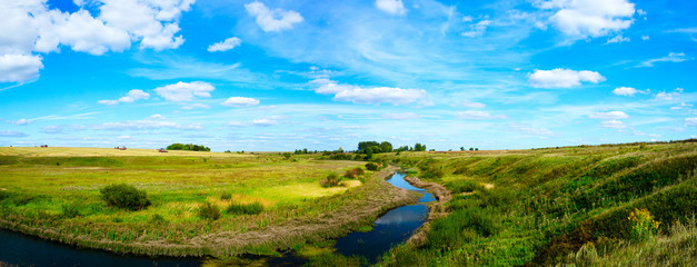 Beautiful panoramic landscape with river and fields