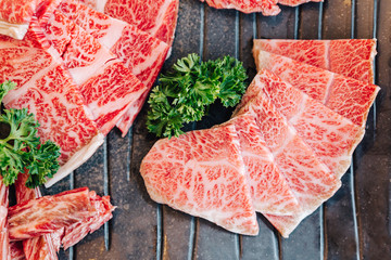 Close-up top view of Premium Rare Slices many parts of Wagyu A5 beef with high-marbled texture on...