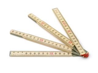 Wooden folding ruler on white background