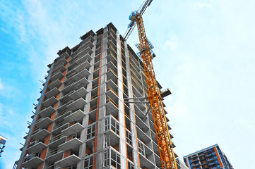 Crane and highrise construction site