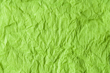 texture, sheet of light green crumpled paper, top view