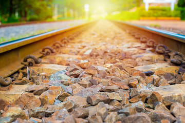 Railroad at sunset, Railway station with colorful blue sky, Industrial landscape with railroad, Railroad travel, railway tourism. Blurred railway, Transportation and Rural industrial concept.