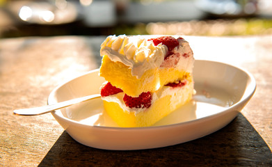 cake  and strawberry with cream on the breakfast table in morning     