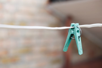 blue clothespin on white wire