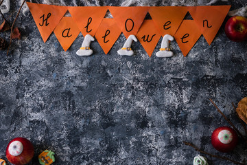 Creative Halloween background with themed marshmallows and apples. Place for text.