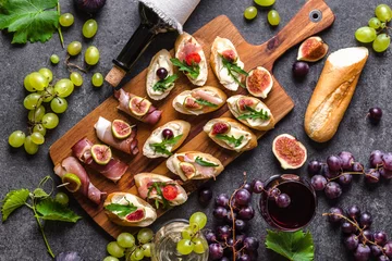 Foto op Aluminium Traditional tapas bar, spanish table with food, platter with appetizers or italian bruschetta with cheese and meat. Wine snack set © alicja neumiler