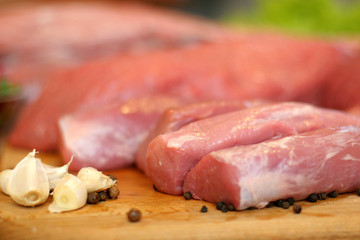 Pork tenderloin. Raw meat in a composition with herbs and spices