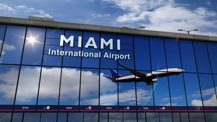 Obraz premium Airplane landing at Miami, Florida mirrored in terminal