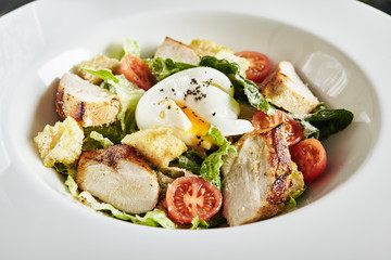 Exquisite Serving White Restaurant Plate of Homemade Chicken and Anchovies Caesar or Cesar Salad