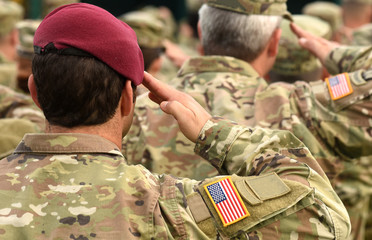 US soldiers giving salute. US army. US troops