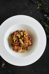Exquisite Serving White Restaurant Plate of Homemade Rigatoni with Bolognese Sauce and Smoked Pork Belly Top View