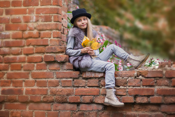 lifestyle concept - beautiful happy little girl enjoying autumn outdoors. Childhood. Holidays.