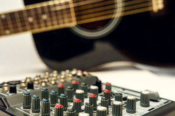 Naklejka premium Close-up sound mixer detail for music mix. Remote for disco and audio.