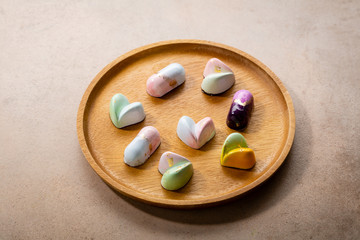 Exclusive chocolate bonbons set on plate, food close-up