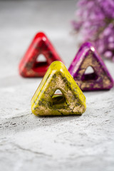 Modern chocolate on concrete background, food close-up