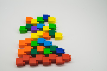 Plastic building blocks lying on the floor isolated on white background