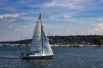 Beautiful view of Lake Geneva and the cityscape of Geneva Switzerland..Sailboat.