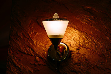 burning lamp on the wall